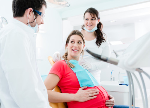 Pregnant woman at dentist before treatment